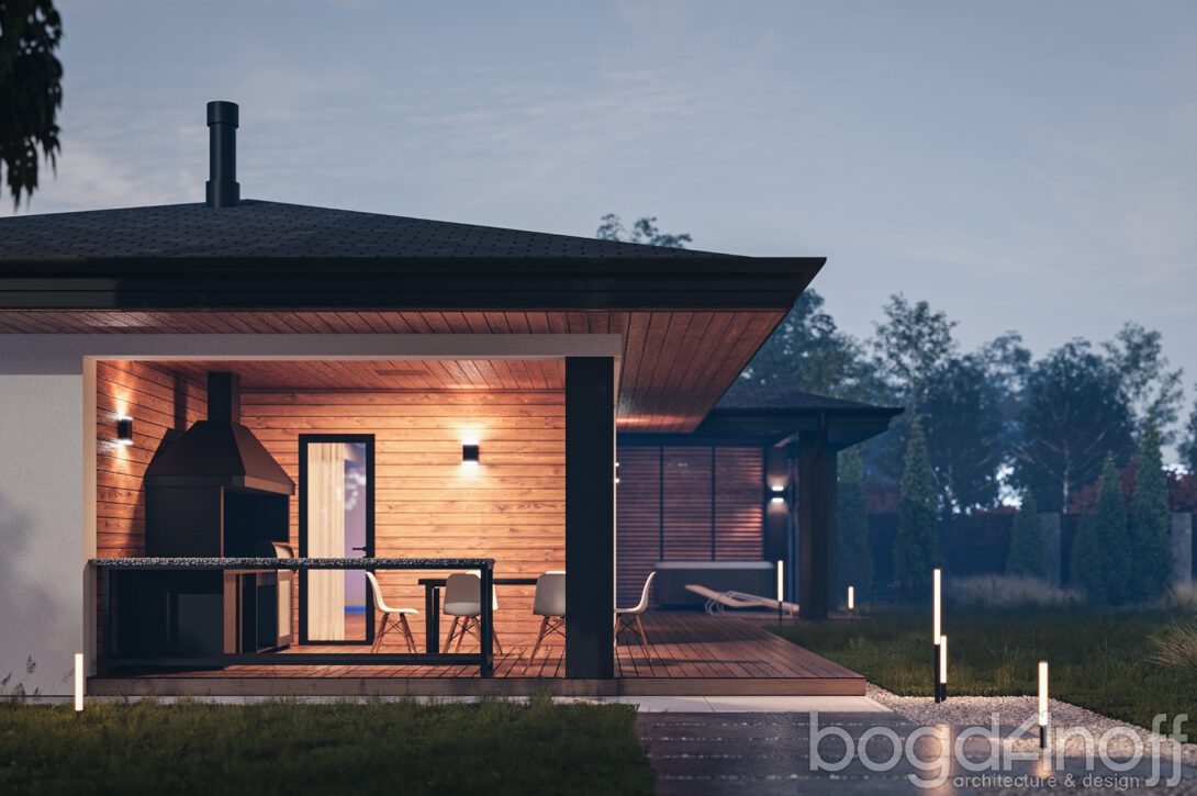 Крупный план каменки-печи в парной с горячими камнями и деревянным ушатом с водой